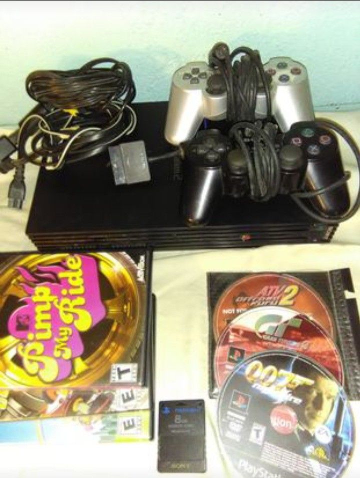 Sony ps2 Bundle 2 controllers 4 used games