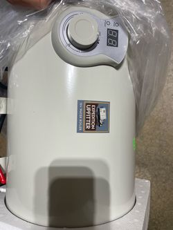 12V Water Boiler, a compact 6-litre (1.6-gallon) tank heater Expedition Upfitter designed for off-grid vans, campers, and RVs