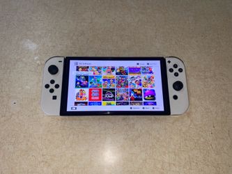 NINTENDO SWITCH OLED + 125 SWITCH GAMES INSTALLED