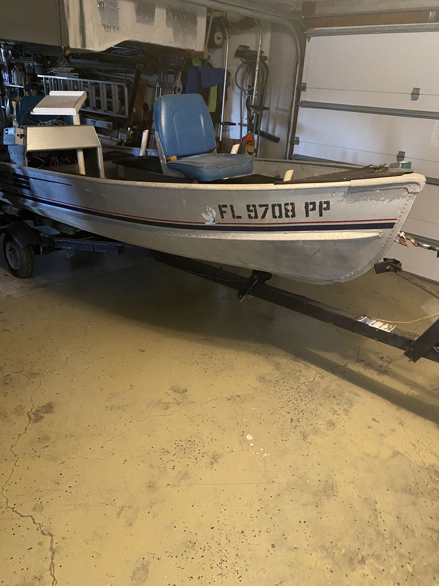 14 foot aluminum fishing boat with 25 hp Evinrude.