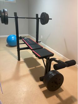 Weight machine with leg extension, adjustable back