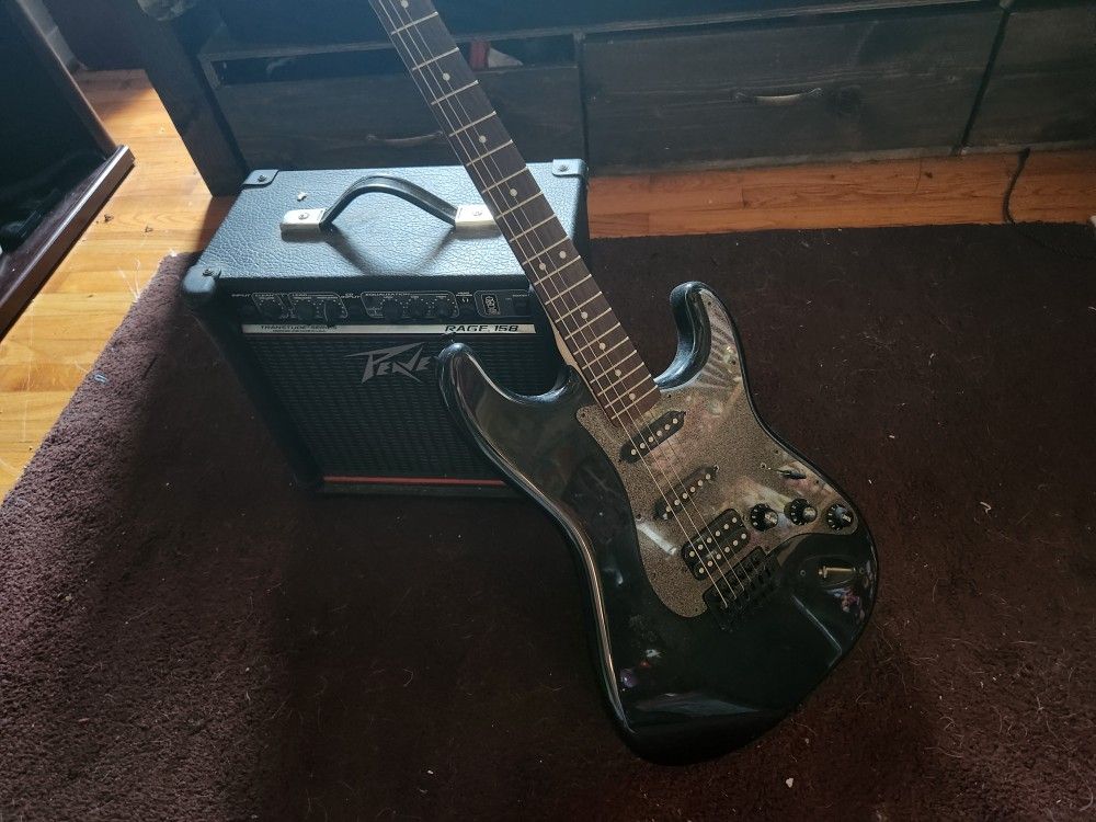 Black Squire Electric Guitar And Peavey Amp