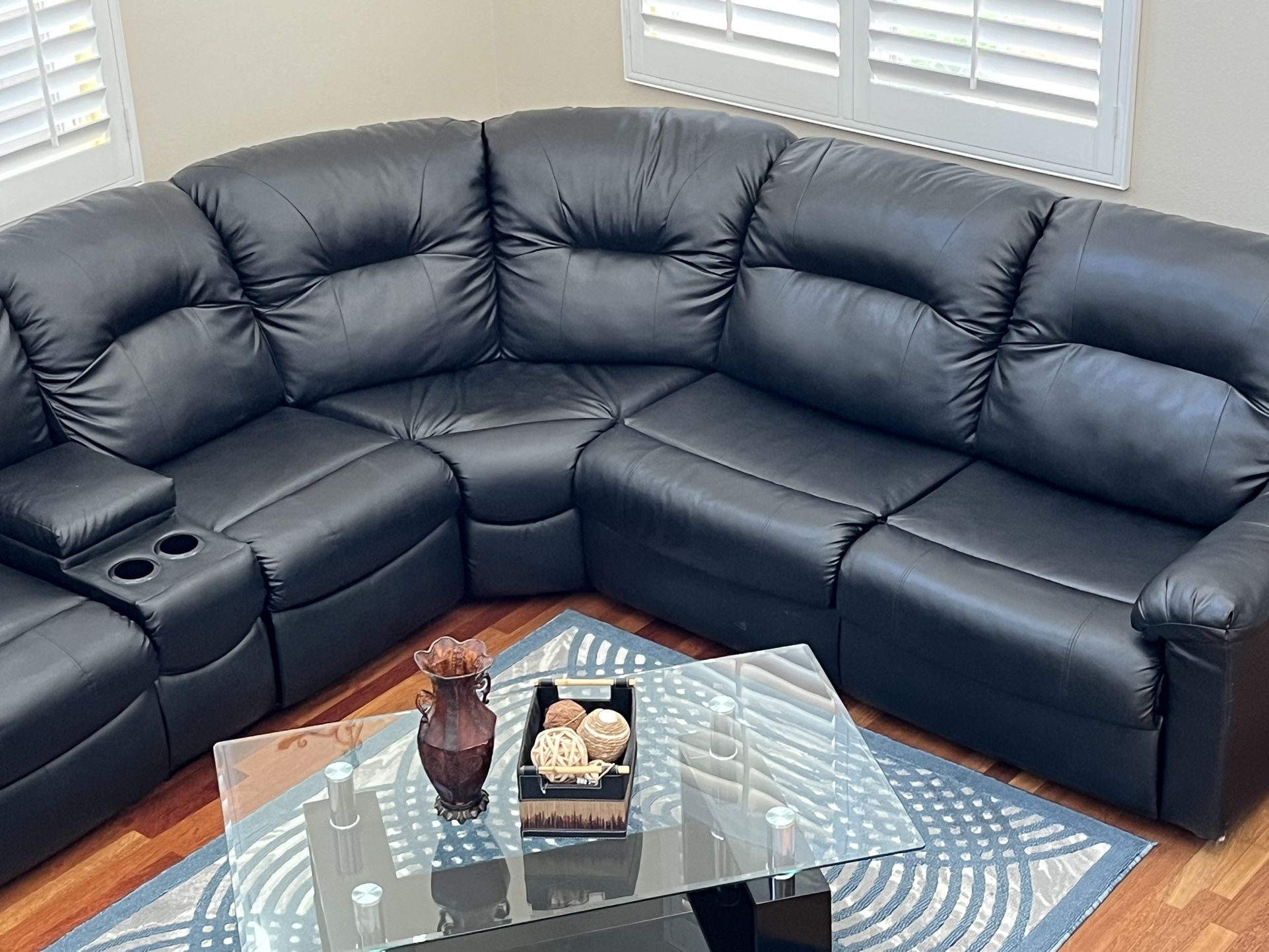 A leather sofa with a queen bed, built-in coffee table