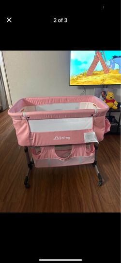 Pink baby bassinet