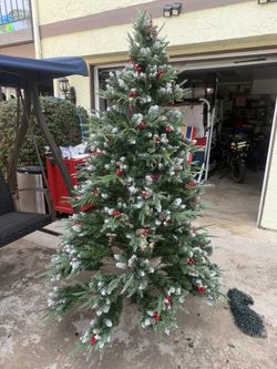 7.5 ft Snow-flocked artificial Christmas pine tree