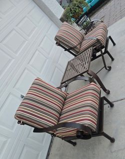 $600 ARIZONA IRON 2 ROCKING CHAIRS AND TABLE WITH NEW SUNBRELLA CUSHIONS