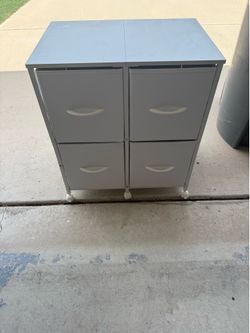 Small rolling cabinet with drawers.