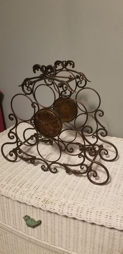 Decorative wrought iron wine bottle display