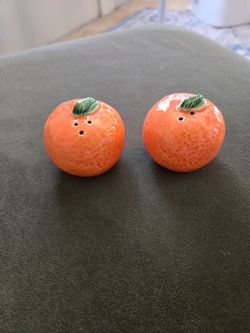 A little oranges, salt and pepper shakers.