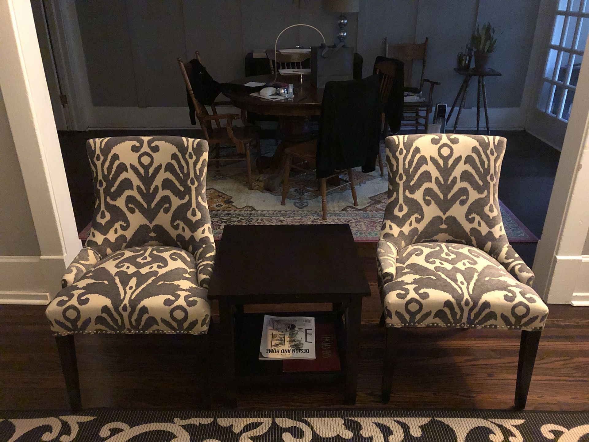 2 Purple accent chairs and black table