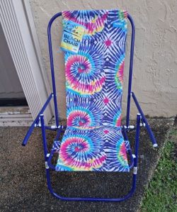 low sand beach chair (one white plastic cap is missing from handle) $5 FIRM