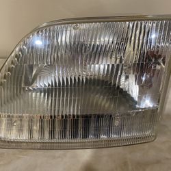 Used OEM Ford F150 / Expedition Driver Side Headlight Lamp OEM 97-03 part # fd 10081-B