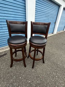 Pair Dark Wood Swivel Bar Stools