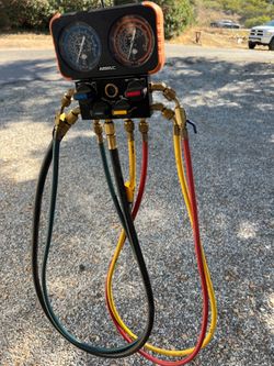 NAVAC 4-Port HVAC Manifold Gauge Set with Hoses and Ball-Valve Ends. Good working condition. Gauges, valves, and hoses included. Great for servicing R