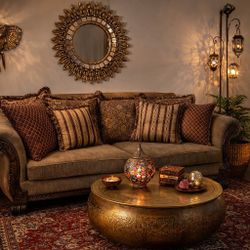 Elegant carved wood sofa with decorative pillows included.8