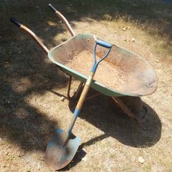 Vintage Rusty Wheelbarrow and Forest King Round Shovel 