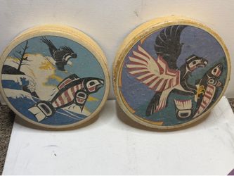 Vintage shamanic drums (hand drums) featuring traditional motifs of the Indigenous peoples of the Pacific Northwest Coast, created by the renowned Can