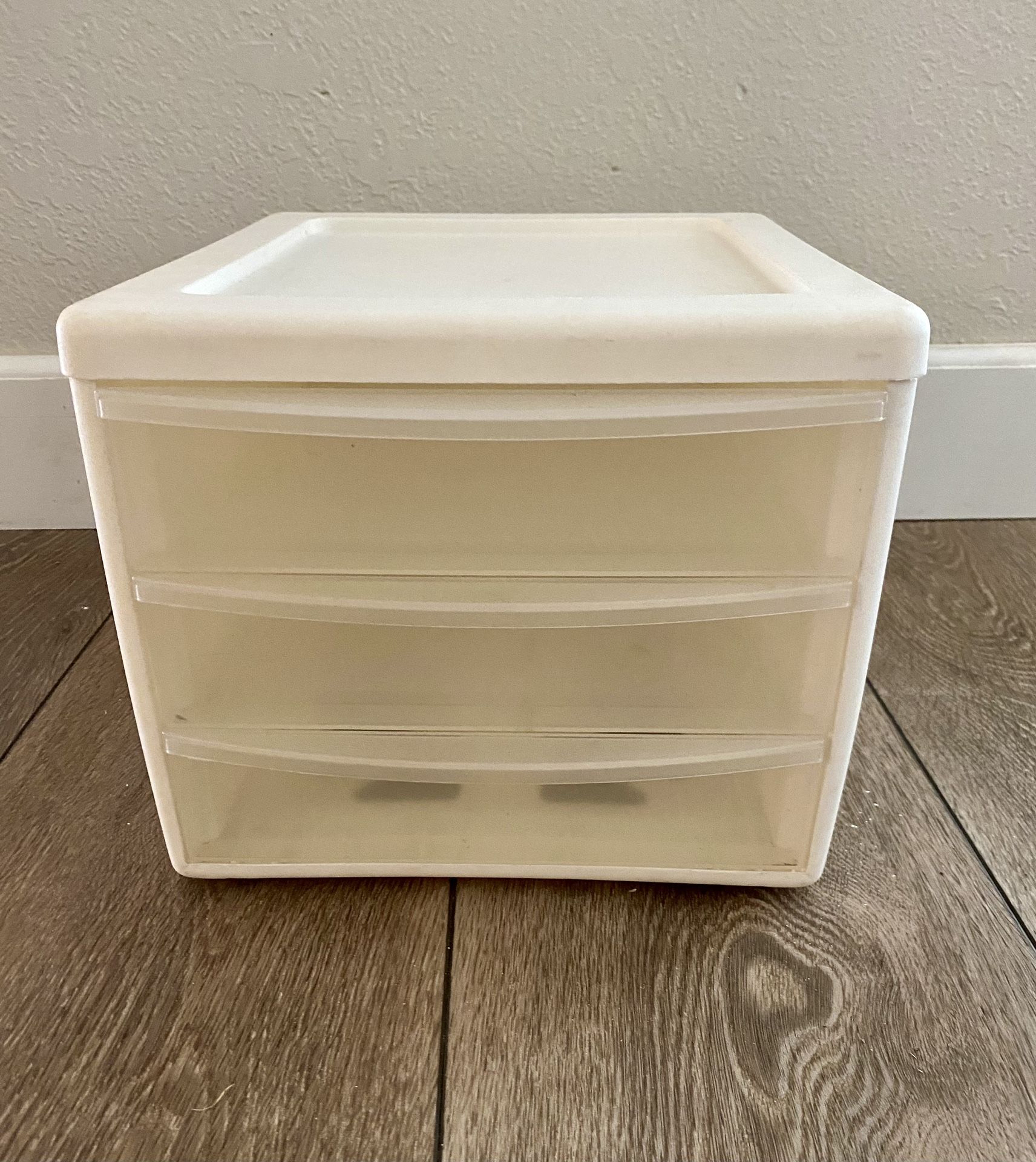 Small White Sterilite Plastic Storage Unit With 3 Clear Colored Drawers