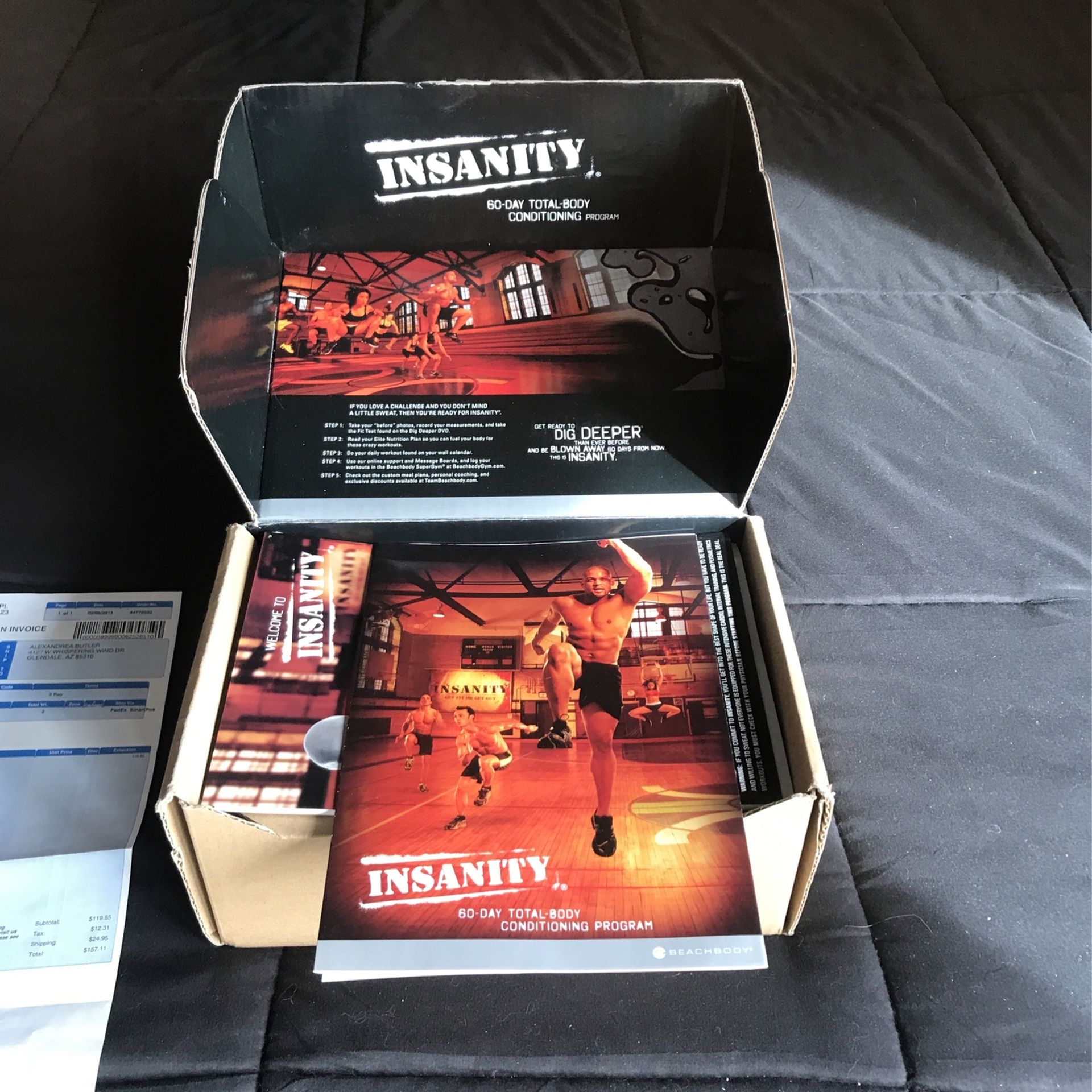 Insanity workout video kit with all the DVDs and books
