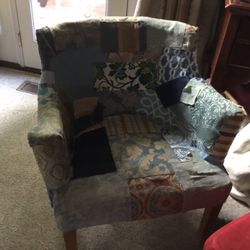 A Nice Old Fashioned , Vintage Chair With  An Ottoman  To Rest Your Feet