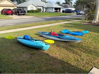 Kayaks with paddles and life vests