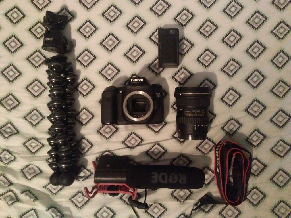 Canon 70D with lens, tripod, mic, and extra battery