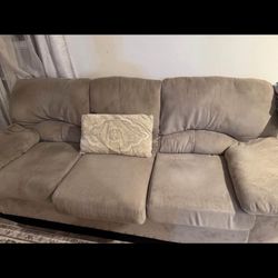 Beige sofa and loveseat