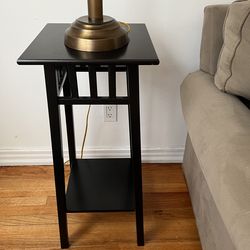 Minimalist mantle black wood side table plants lamps and more