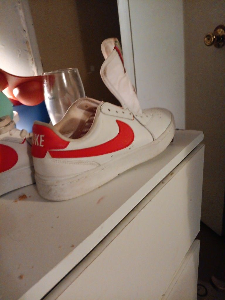 Red/white Nikes. Blue /white Nikes