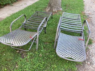 Two lay flat lounge chairs