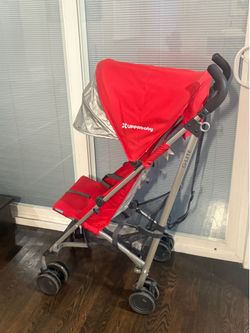 Red Uppababy G-lite stroller
