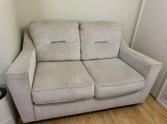 Ashley Furniture Neutral Beige Upholstered Loveseat / Small Sofa