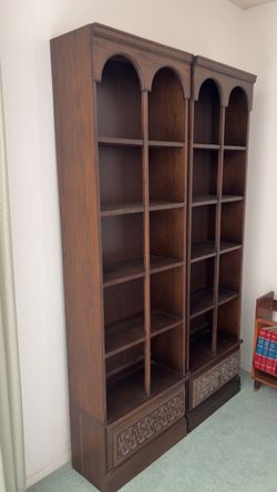 Tall Dark Wood Bookcase with Carved Detail