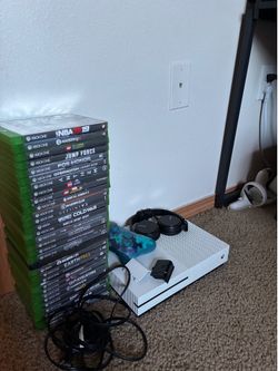 Great condition xbox one s with 31 games controller headphones and cords