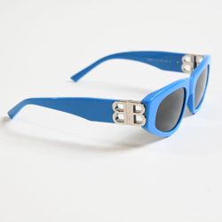 Sunglasses with a gold logo. Brand new.