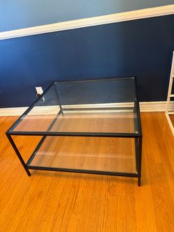Glass and Black Metal Coffee Table