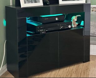 Like new black corner tv stand with cabinet and light change