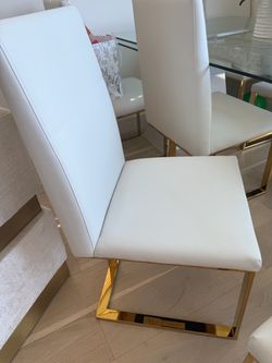 8 White and gold leather chairs