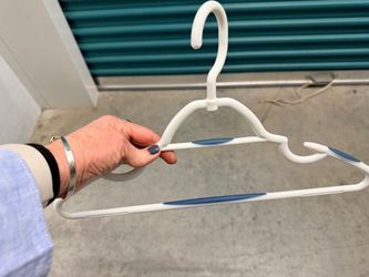 Clothes Hangers - 73 White Plastic Hangers with Blue Rubber Grips and Strap Hooks.  Brand: Honey- Can-Do