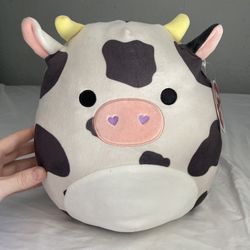Colin the Cow 12” Squishmallow Stuffed Animal Plush - White with Black Spots Purple Heart Nostrils Yellow Horns  Great pre-owned condition. Tags still