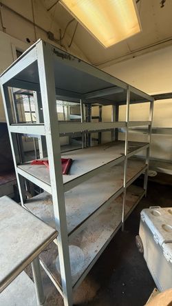 Steel Fabricated shelf storage heavy duty industrial grade. 5ft tall, 6ft in length by 22” in width.