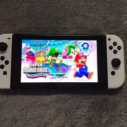 NINTENDO SWITCH V2 with 100 SWITCH GAMES and 7500 RETEO GAMES
