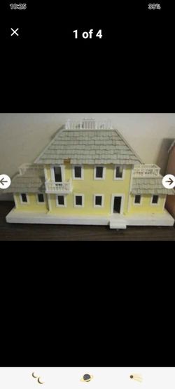Very large dollhouse on platform with wheels