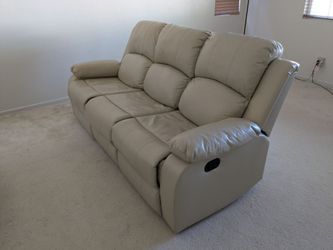 Beige Faux Leather Reclining Loveseat with Center Console