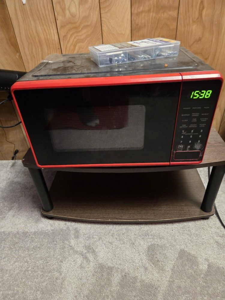 Black Microwave with red trim