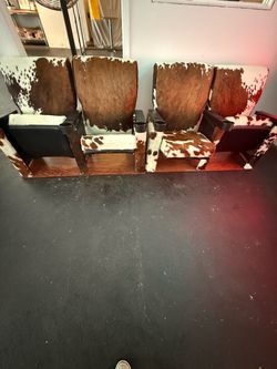 Cowhide upholstered vintage theater chairs from Hollywood California