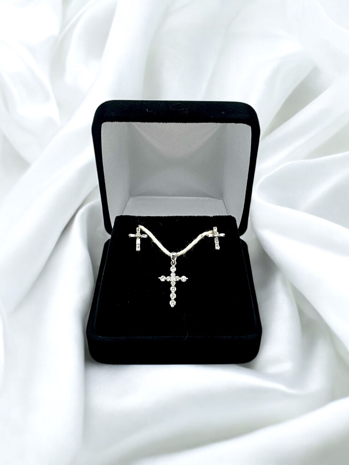 14kt 2.20g White Gold with Small Round Diamonds Cross Pendant and Baguette/Small Round Cut Diamond Cross Earrings.