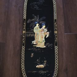 MCM Chinese black lacquer wall panel featuring intricate mother-of-pearl inlay and gold paint details depicting geisha figures. 36"×12"