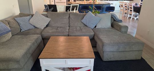 Gray blue sectional plus pillow covers and blankets