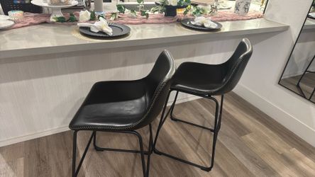 two leather barstools